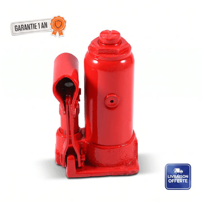 Cric hydraulique bouteille 2 tonnes posé sur le sol d'un garage